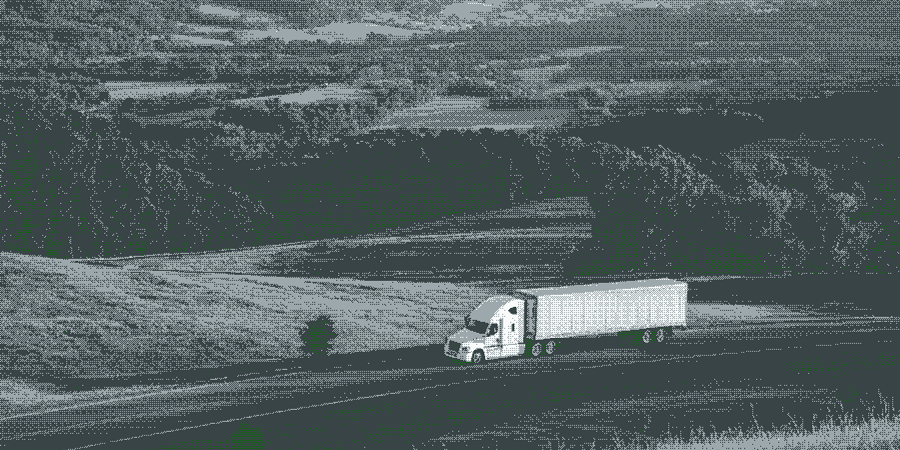 Semi truck on a mountain valley road